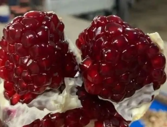 Close-up of ruby-red pomegranate arils